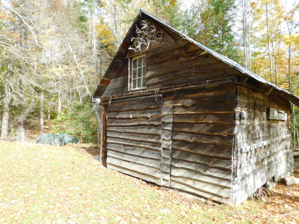 Boathouse at Goodnow flow holding Adirondack finch pruyn forestry maps